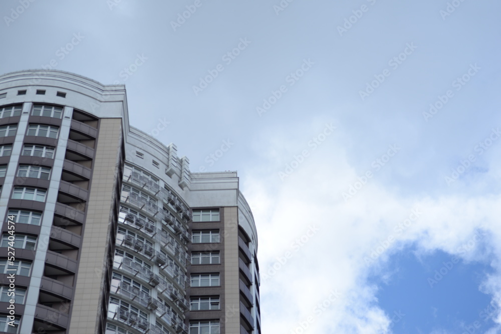 modern buildings against the background of a cloudy sky, a green new building a large number of windows, entire buildings in Ukraine, the top angle of the photo modern buildings against the background of a cloudy sky, a green new building a large number of windows, entire buildings in Ukraine, the top angle of the photo