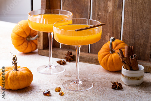 Halloween, Thanksgiving or fall cocktail pumpkin martini, homemade festive seasonal drink pumpkintini with cinnamon