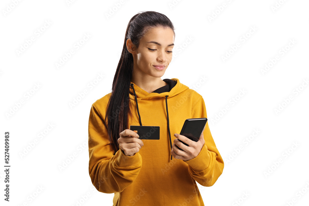 Young woman shopping online with a credit card and a smartphone - obrazy, fototapety, plakaty 