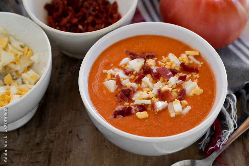 Traditional andalusian salmorejo cold soup served withboiled egg and serrano ham Traditional andalusian salmorejo cold soup served withboiled egg and serrano ham