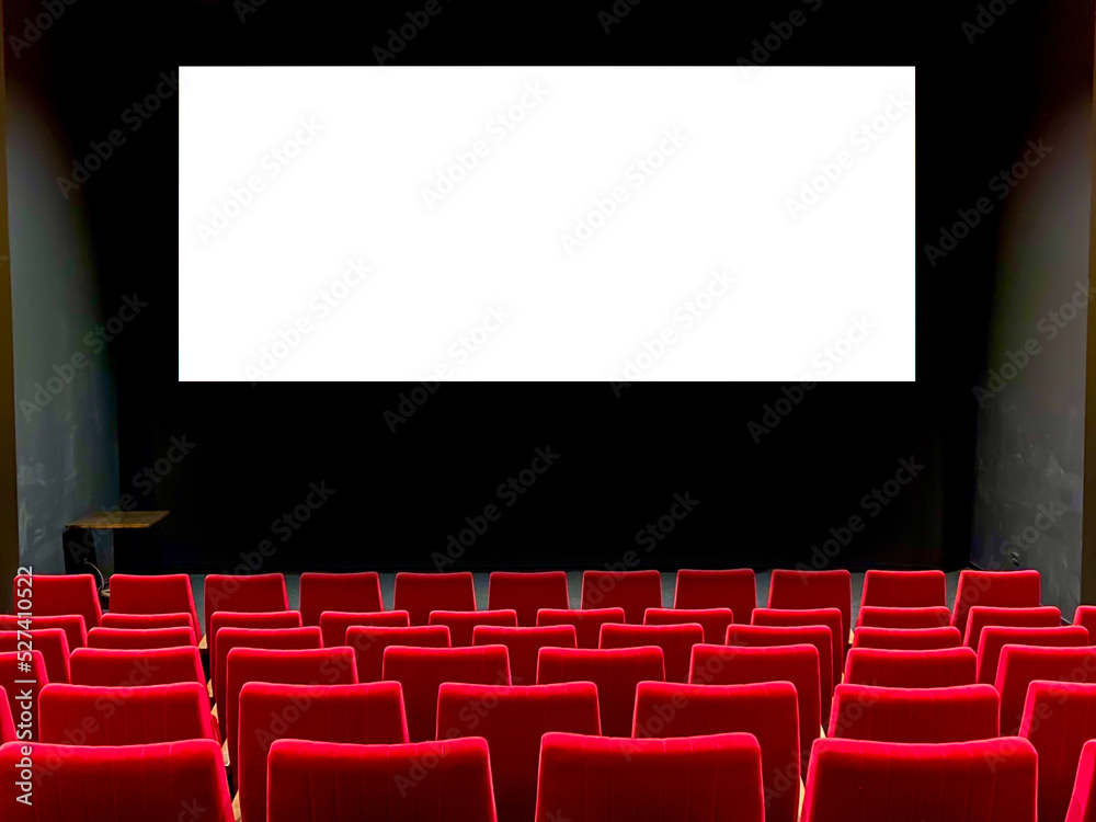Interior of art cinema movie house red soft seating in a row. Large flat white screen mock-up on the wall for advertising. Interior of art cinema movie house red soft seating in a row. Large flat white screen mock-up on the wall for advertising.