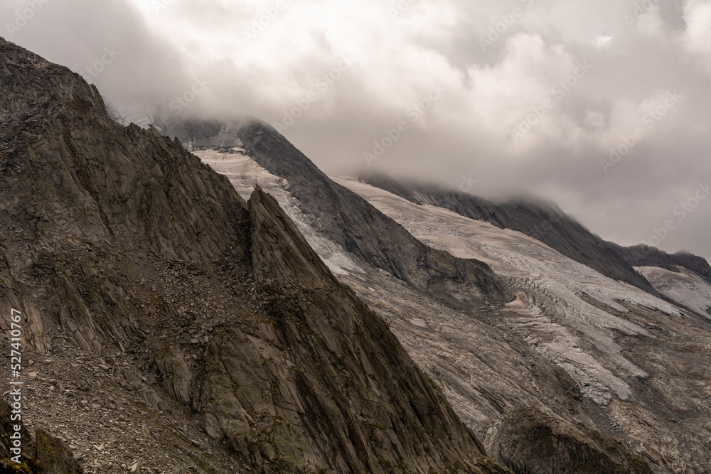 Alpine mountain peaks covered in clouds