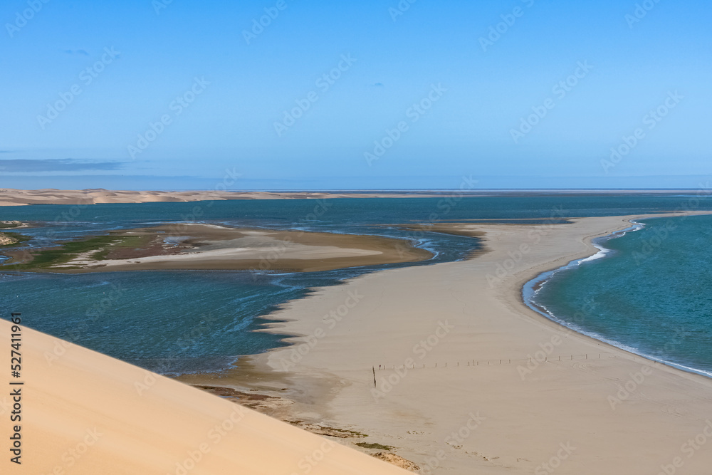 Namibia, the Namib desert, landscape of yellow dunes falling into the sea
