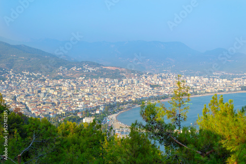 View to the sea coast line of Alanya city, Turkey, resort area in summer time under the blue sky, blue waters © Григорий Стоякин