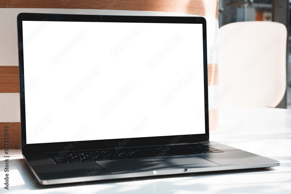 Laptop mockup with white screen in business office or shopping mall. Empty copy space, blank screen mockup. Soft focus laptop with interor background. Travel, study and office work concept Laptop mockup with white screen in business office or shopping mall. Empty copy space, blank screen mockup. Soft focus laptop with interor background. Travel, study and office work concept