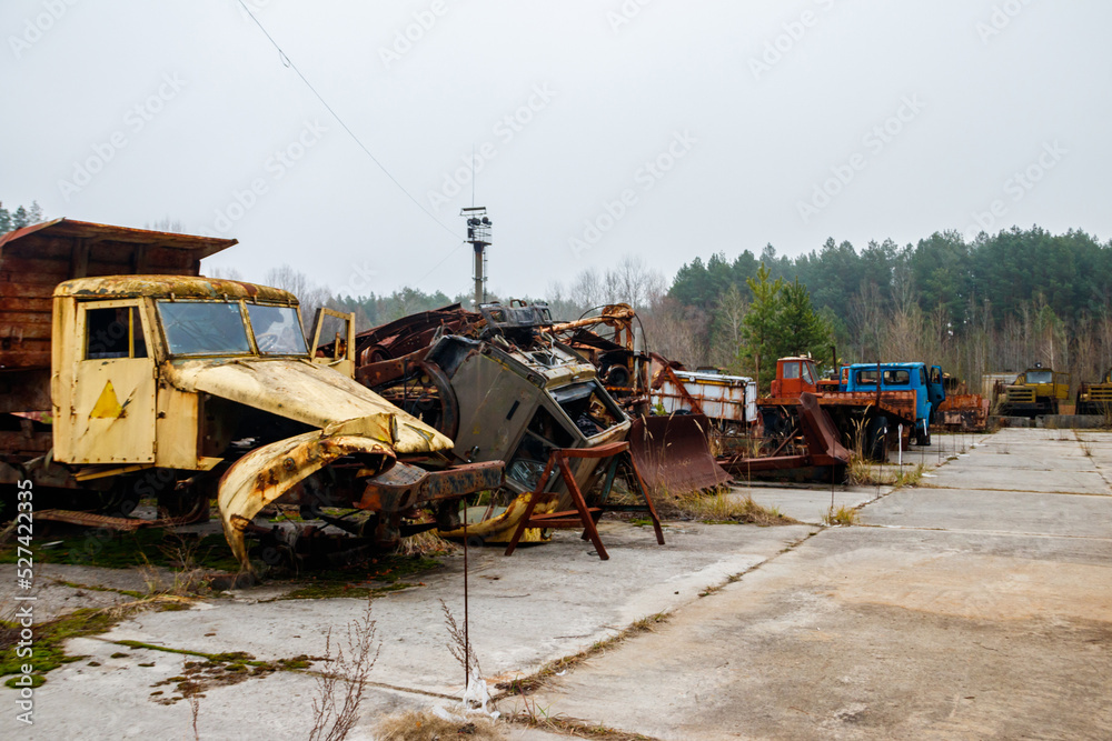 Obraz premium Old rusty abandoned damaged trucks in Chernobyl exclusion zone, Ukraine