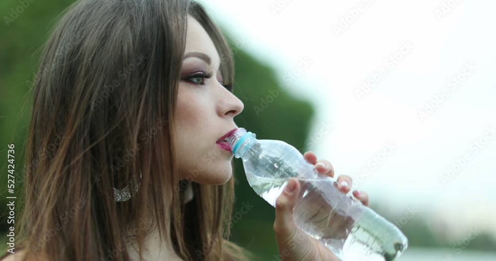 Closeup of attracrive young woman drinking water Closeup of attracrive young woman drinking water