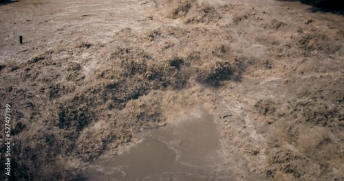 Rivers flood. Crowded river overflows its banks. Raging river with dirty water. Disaster flood deluge and water flow after rainfall.