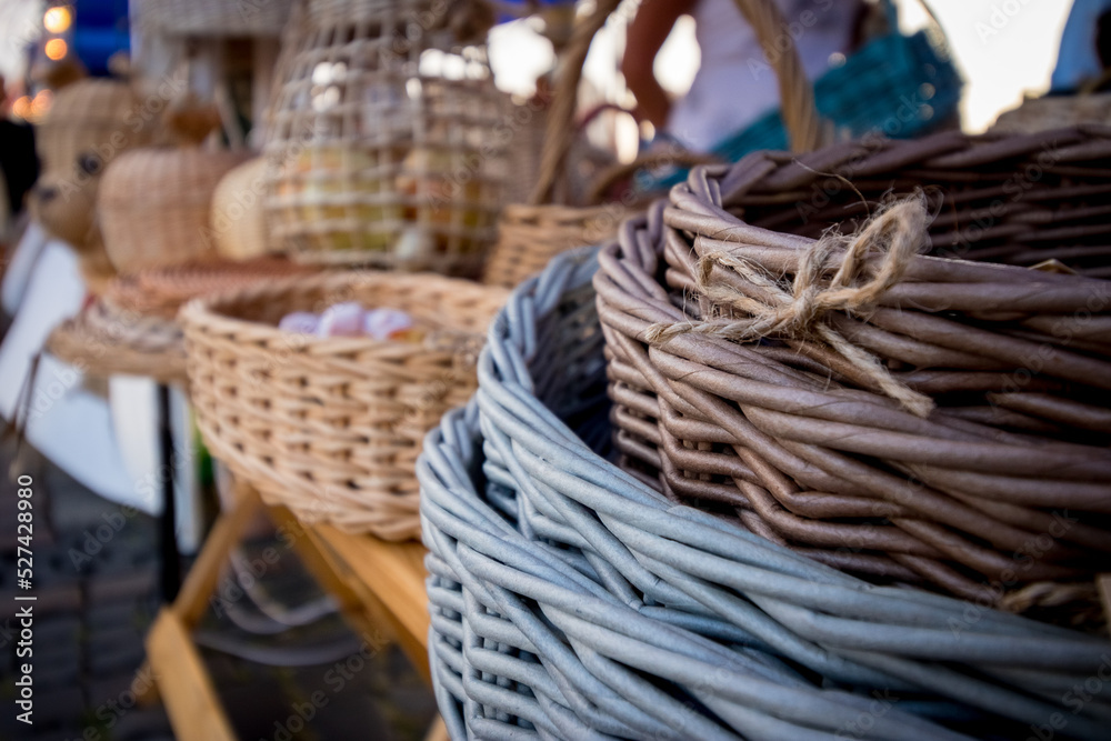 Wicker craft baskets. A bunch of birch baskets. A pile of birch bark bast baskets. Handmade, culture of the nation
