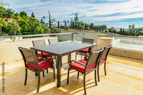 a dining table on a luxury terrace overlooking the Mediterranean coastline  © josehidalgo87
