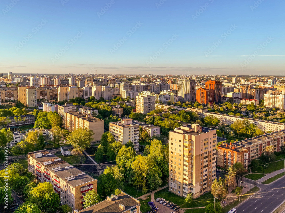panorama of the city from above. high residential buildings made of concrete for people's lives. near a green park, a lot of trees. city view