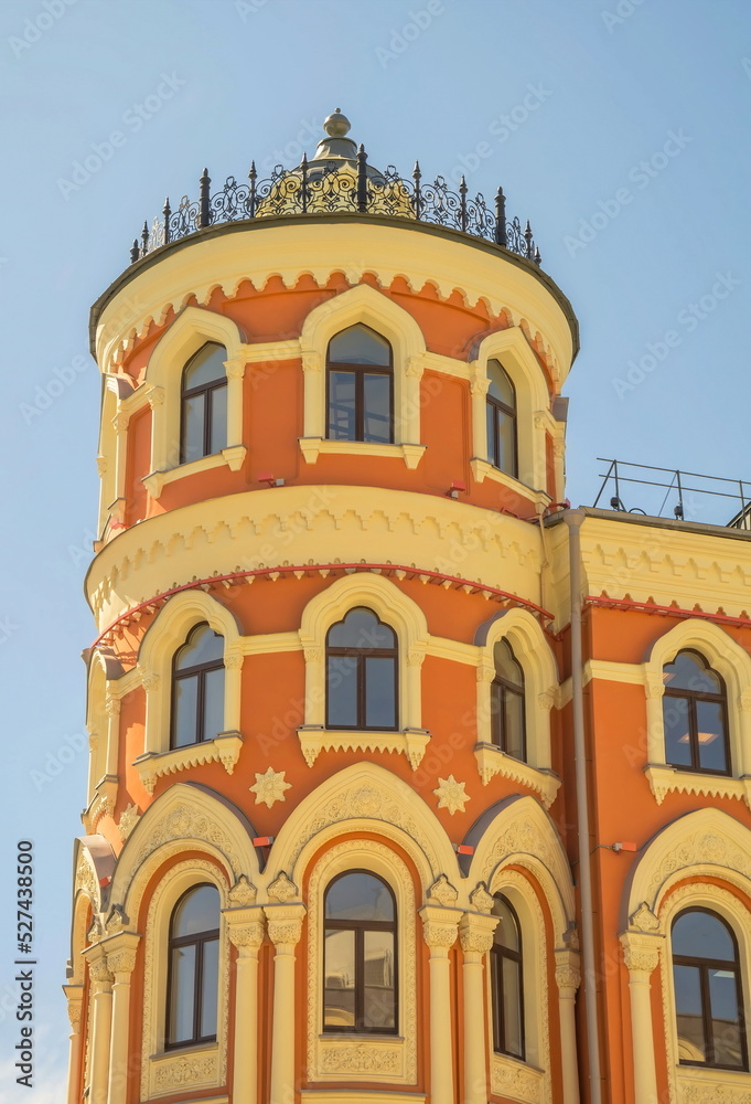 Obraz premium The round tower of the old house is stylized in the Gothic style