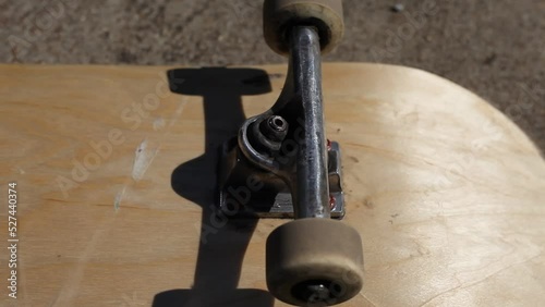 Skateboard Wheels Rolling Mid Afternoon Sunlight Outdoor Lighting photo