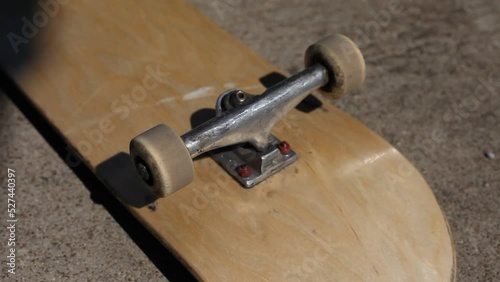 Skateboard Wheels Rolling Mid Afternoon Sunlight Outdoor Lighting photo