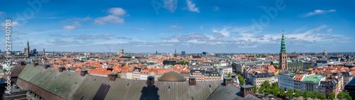 Panorama view Copenhagen, Denmark skyline from Christiansborg Palace tower. Aerial view of roofs and cityscape on a sunny day with the towers of the most important sightseeing spots