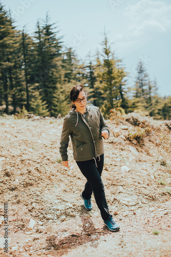 Young woman playing sports in the forest