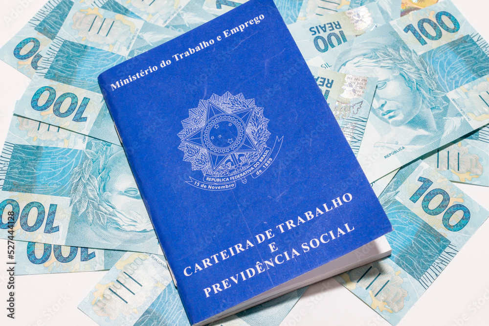 brazilian money banknotes and work card Employment and financial control concept brazilian money banknotes and work card Employment and financial control concept