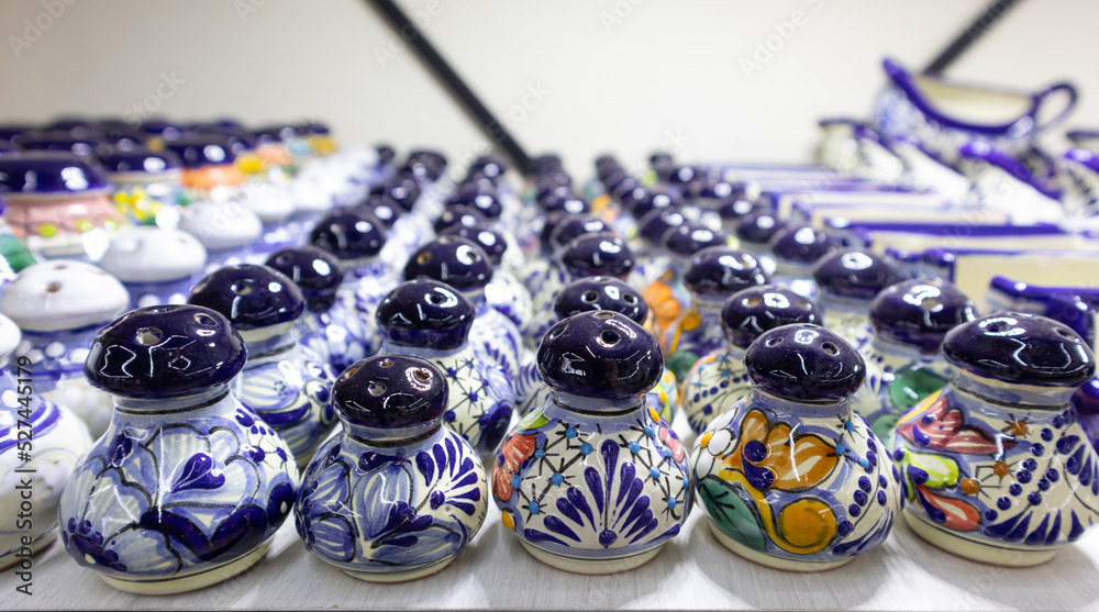 bunch of salt shakers, souvenirs for tourists in Puebla, Mexico, colorful salt shaker of traditional mexican talavera pottery repetitive pattern texture background