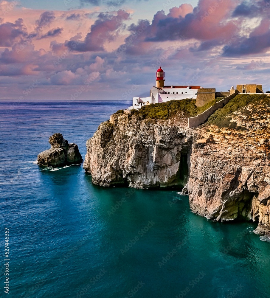 Lighthouse By Sea Against Sky - obrazy, fototapety, plakaty 