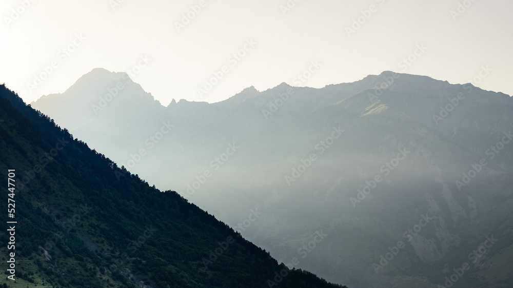 Naklejka premium mountains in the fog