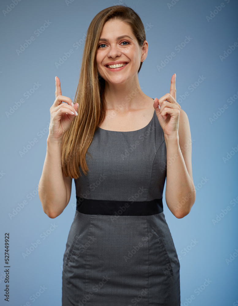 Female smiling businessperson pointing fingers up. isolated portrait. Female smiling businessperson pointing fingers up. isolated portrait.