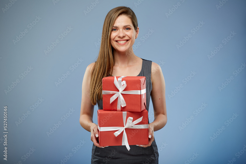 Happy business woman holding red gift boxes. Happy business woman holding red gift boxes.