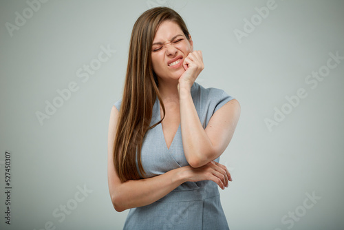 Woman with toothache touching cheek. isolated female painful portrait. Closed eyes.