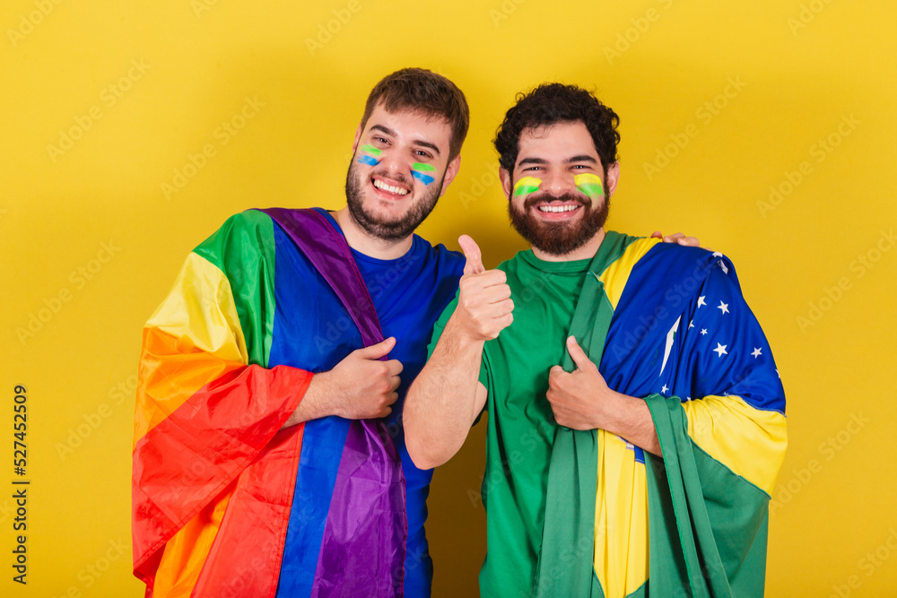 couple of men, brazilian, soccer fans from brazil, wearing LGBT flag,.concept of diversity