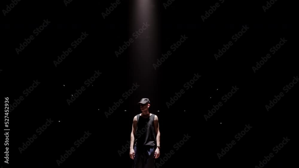 b-boy is performing active dance with elements of breaking, popping and locking dance styles b-boy is performing active dance with elements of breaking, popping and locking dance styles