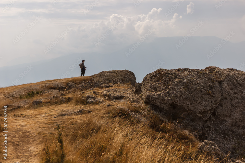 tourist on the rock of the top of the Demerdzhi mountain range