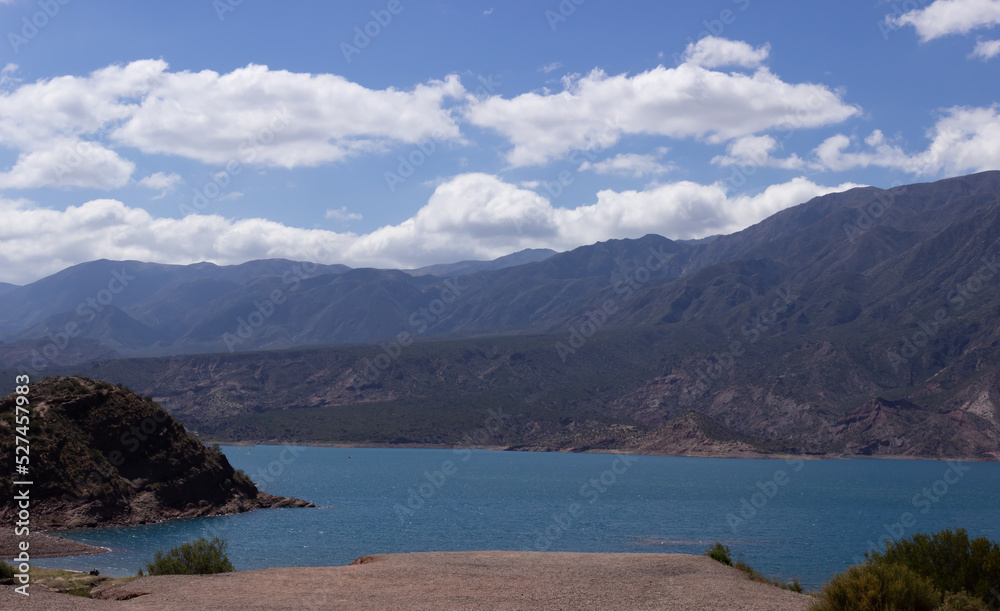 Beautiful scenery with a lake and mountains on a cloudy day.