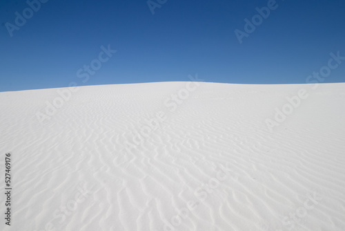 white sand dune and blue sky