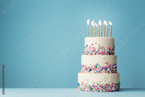 Leinwand Poster Birthday Cake With Three Tiers And Colorful Sprinkles