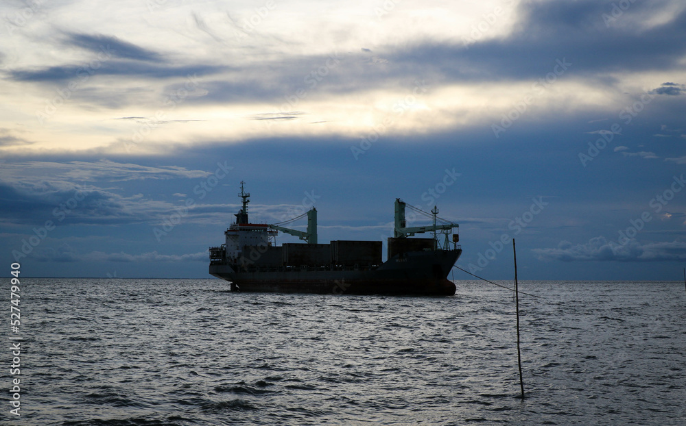 Cargo Ship in the Sea in the Evening