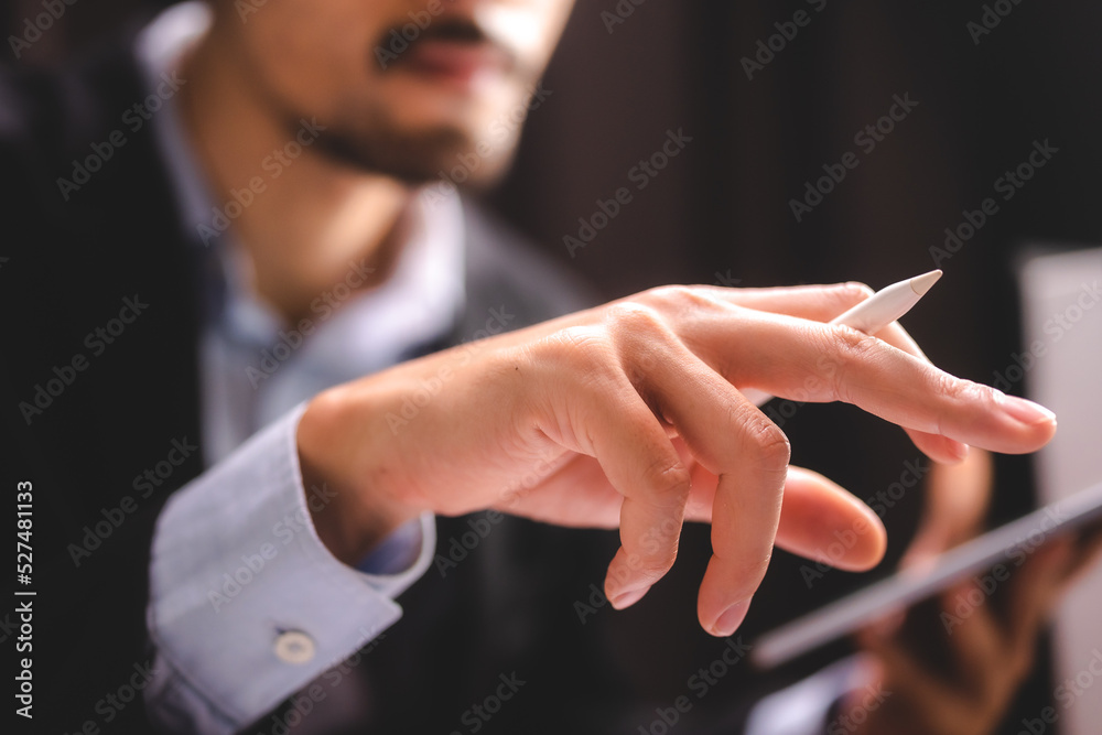 Obraz premium professional business person using hand to working with date on digital tablet, modern internet communication technology, businessman or office man working on screen surface of computer laptop device