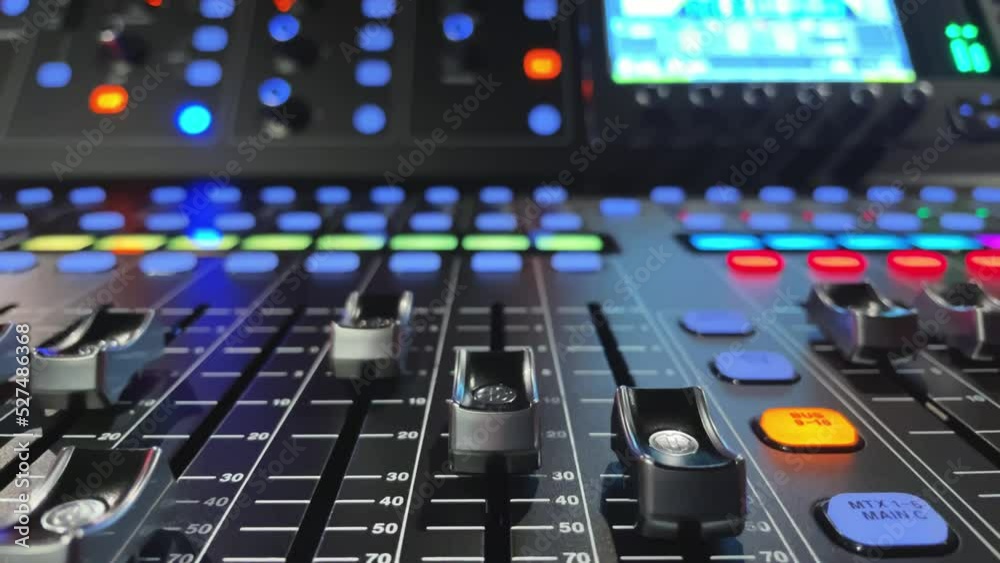 Detail of mixing desk or concole and moving volume faders in slow motion, digital or automatic, no hands or fingers Detail of mixing desk or concole and moving volume faders in slow motion, digital or automatic, no hands or fingers