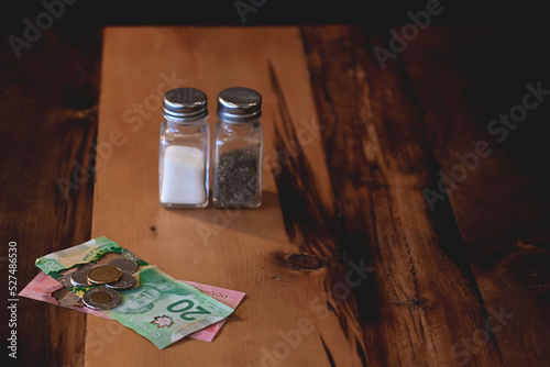 Bilde på lerret Canadian cash money on restaurant table