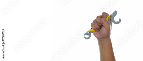 Hand  holding self adjusting wrench isolated white background with copy space photo