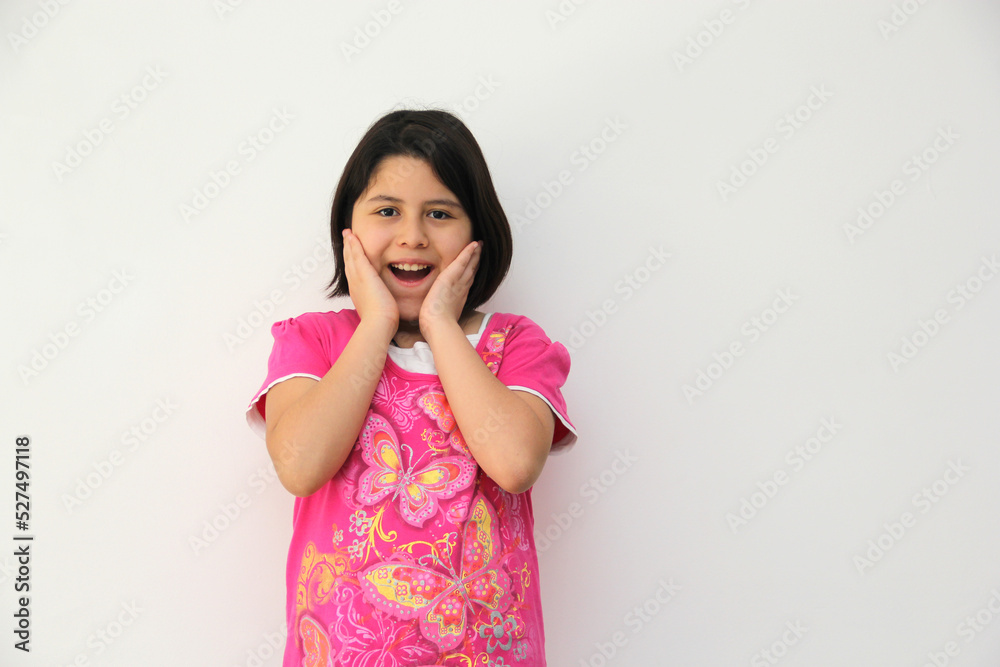 Happy and excited Hispanic 10-year-old girl is amazed at a promotion or discount of something that children like very much
Happy and excited Hispanic 10-year-old girl is amazed at a promotion or discount of something that children like very much