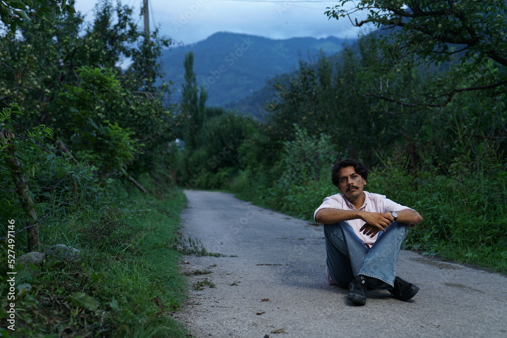 person sitting on the rocks