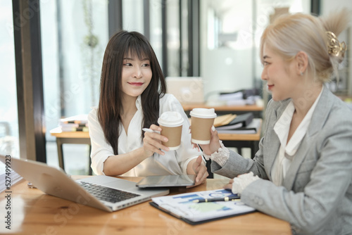 Asian businesswoman using calculator and financial documents at the table office, business financial concept.