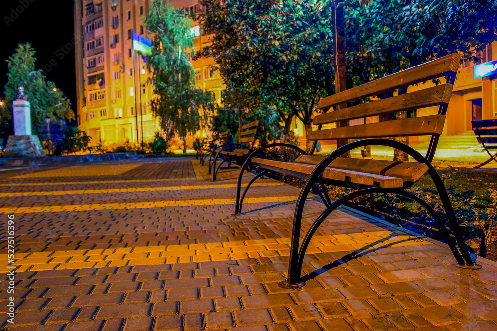 Empty benches in the park at night	
