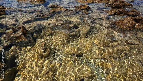 stones in clear sea water