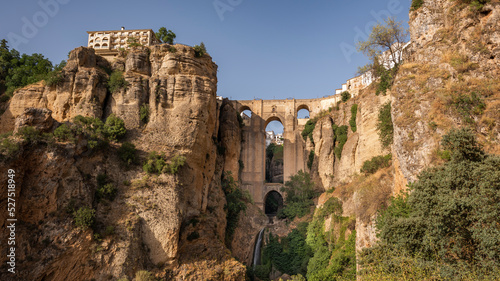 View of Ronda city, Malaga province, Andalusia, Spain. The Puente Nuevo "New Bridge" connects the two sides of the city by crossing the the Guadalevín river canyon also known as El Tajo canyon.