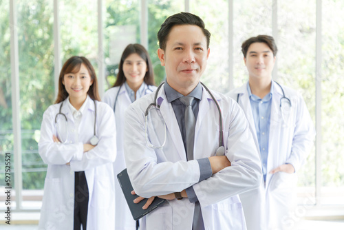 Medicine and healthcare concept   Group of serious asian doctors Line up  Male and Female are standing in lobby of hospital.
