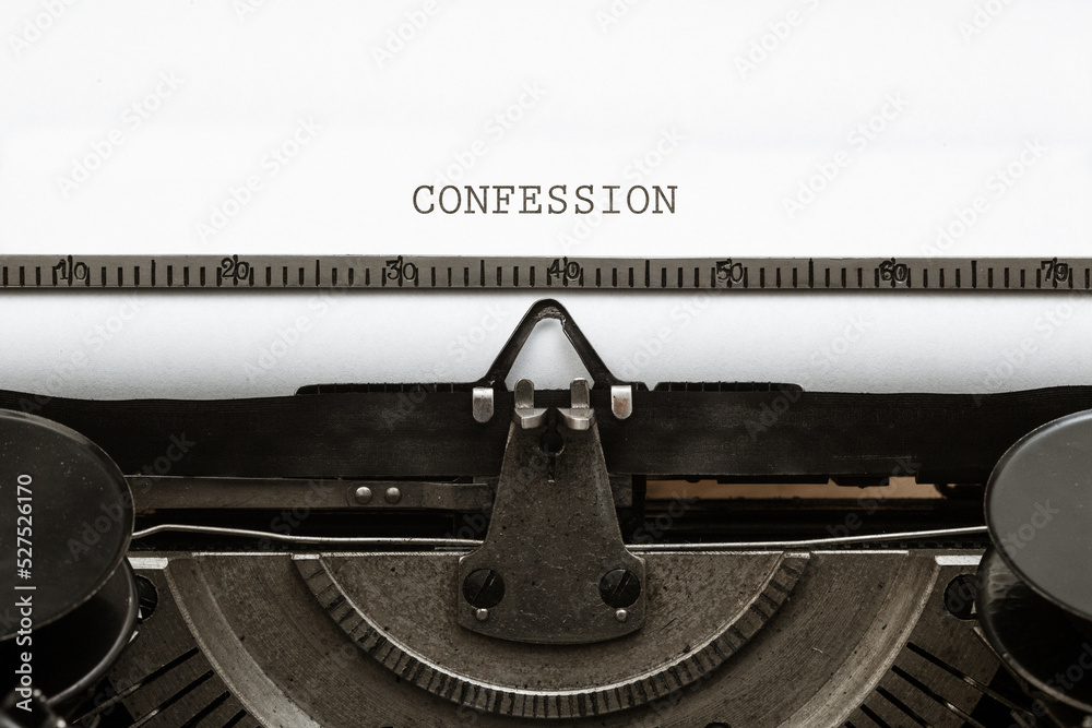 Confession headline written on vintage type writer from 1920s