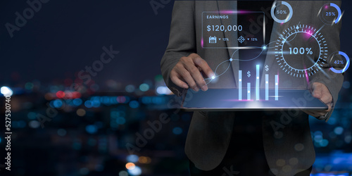 businessman using tablet analyzing sales data, home loan interest rate, finance, finance and profit design photo