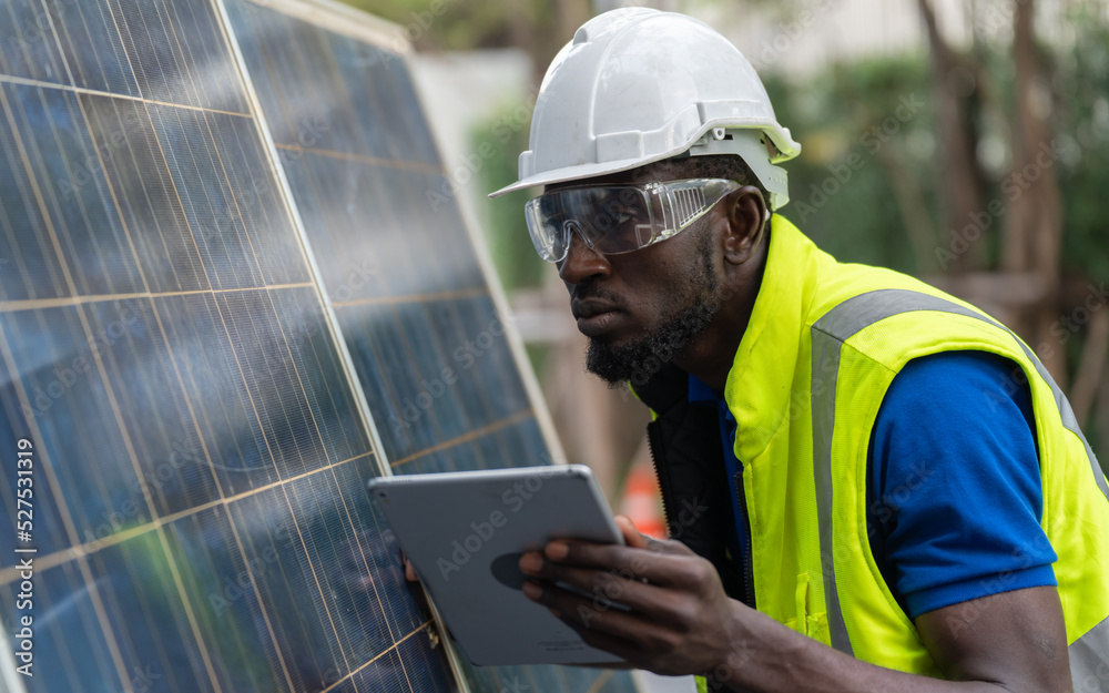solar power plant engineers and examining photovoltaic panels. Concept of alternative energy and its service. Electrical and instrument technician..