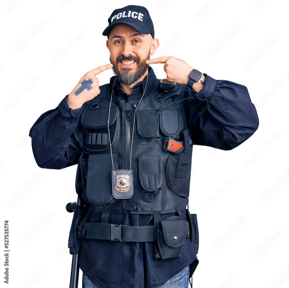 Young handsome man wearing police uniform smiling cheerful showing and pointing with fingers teeth and mouth. dental health concept. Young handsome man wearing police uniform smiling cheerful showing and pointing with fingers teeth and mouth. dental health concept.