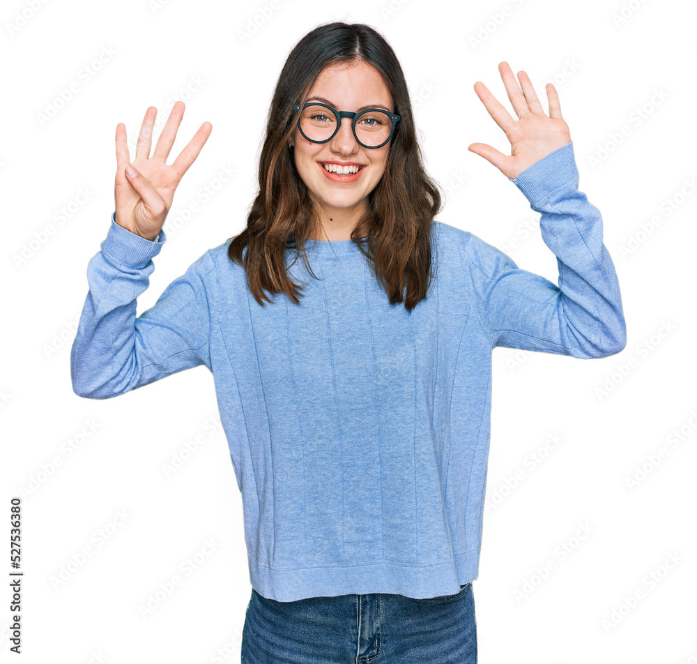 Young beautiful woman wearing casual clothes and glasses showing and pointing up with fingers number nine while smiling confident and happy. Young beautiful woman wearing casual clothes and glasses showing and pointing up with fingers number nine while smiling confident and happy.